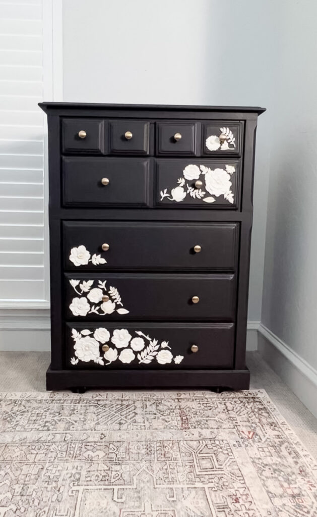 black dresser with flower appliques