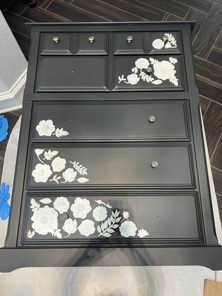dark dresser with resin flowers