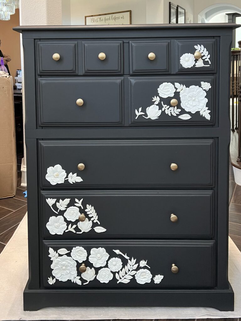 black dresser with resin flowers