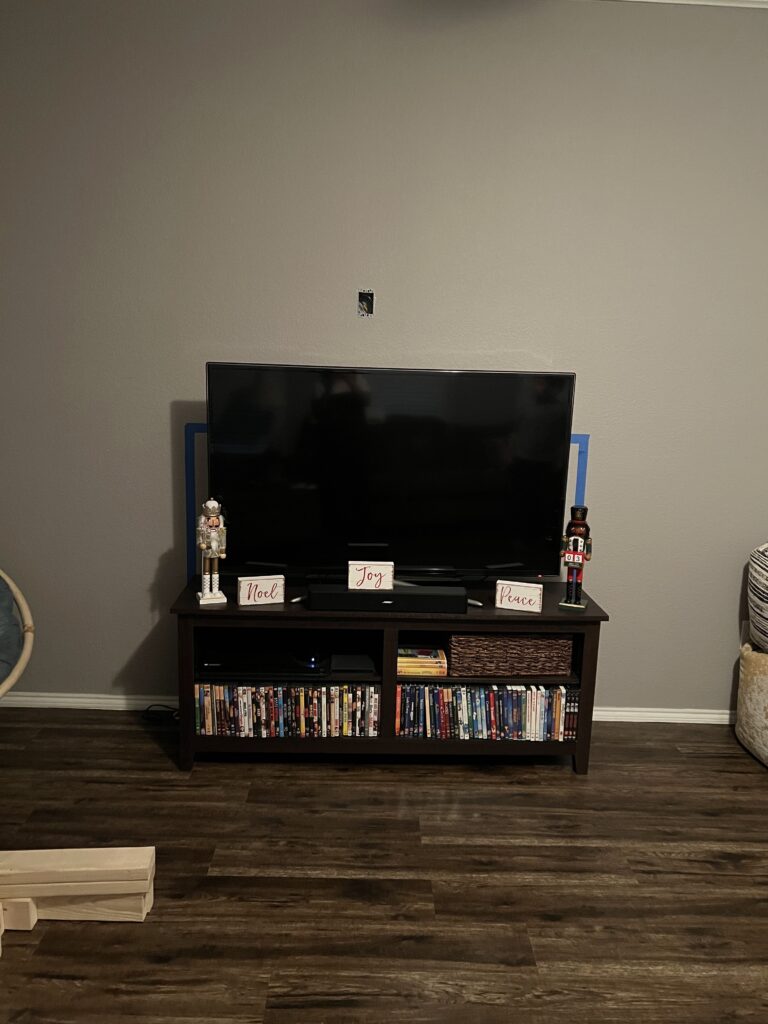 Wall marked and outlets installed, ready for framing the DIY electric fireplace surround.