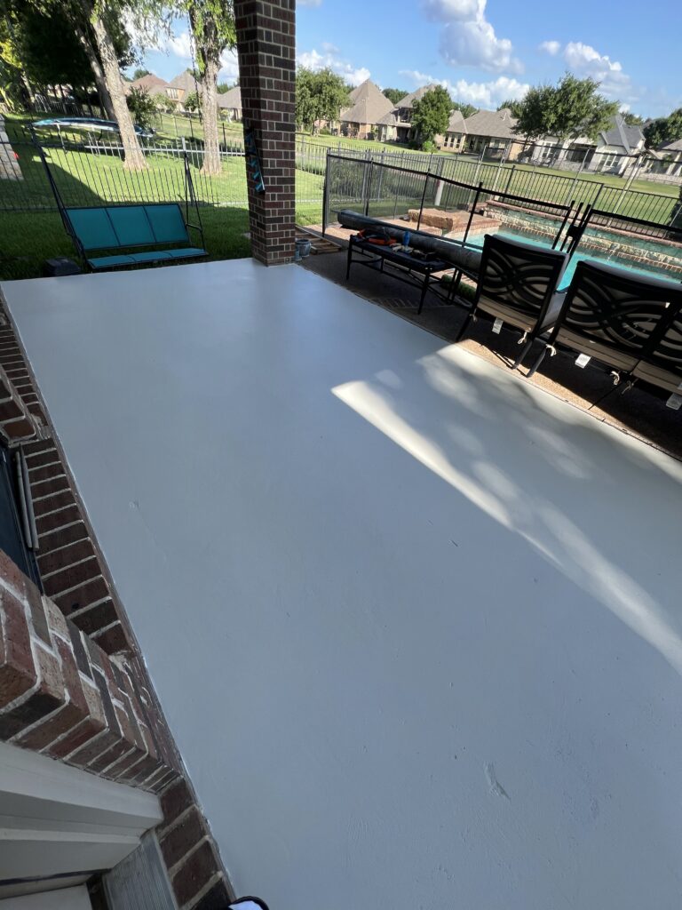 Patio fully painted with an off-white base coat before adding the checkered pattern.