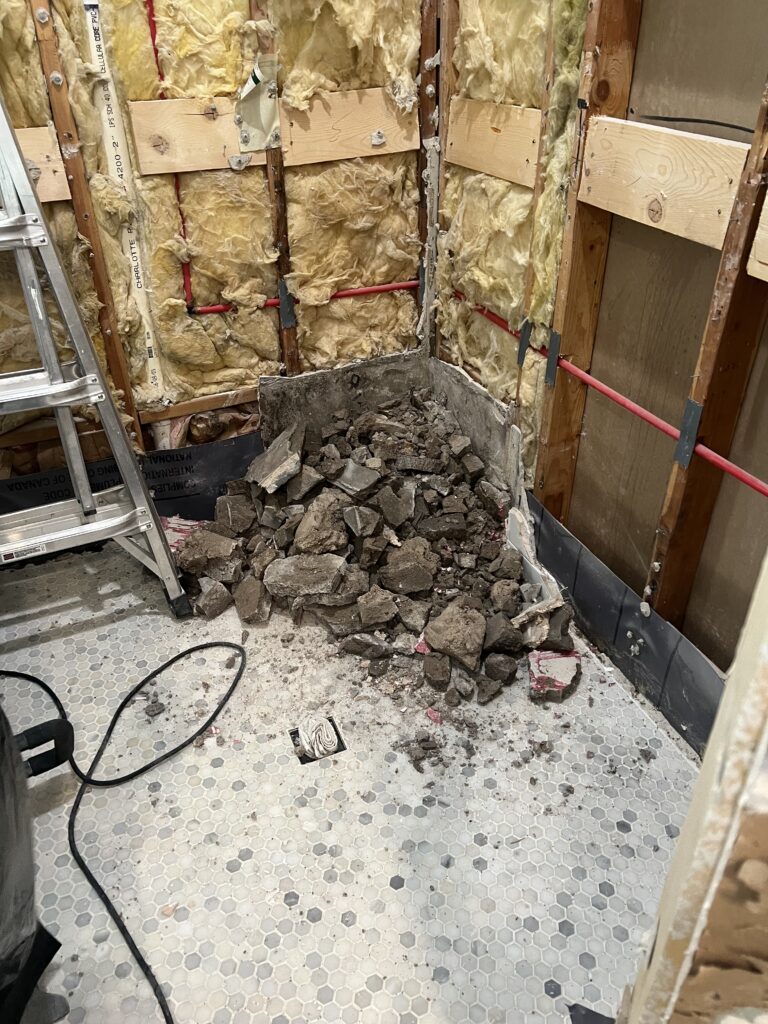 Shower demo, demo'd shower seat, bathroom remodel, shower leak, failed shower liner