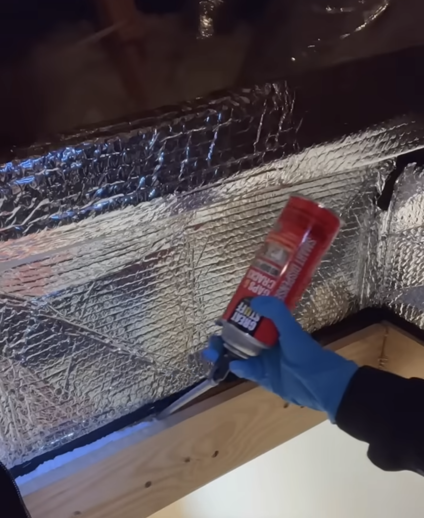 sealing an attic cover in place to insulate the attic hatch